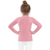 Child wearing Fairy Castle Dreamland Kids Rash Guard outdoors.